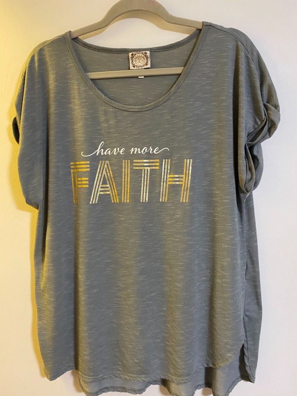 Soft gray graphic tee with metallic gold “Have More Faith” lettering